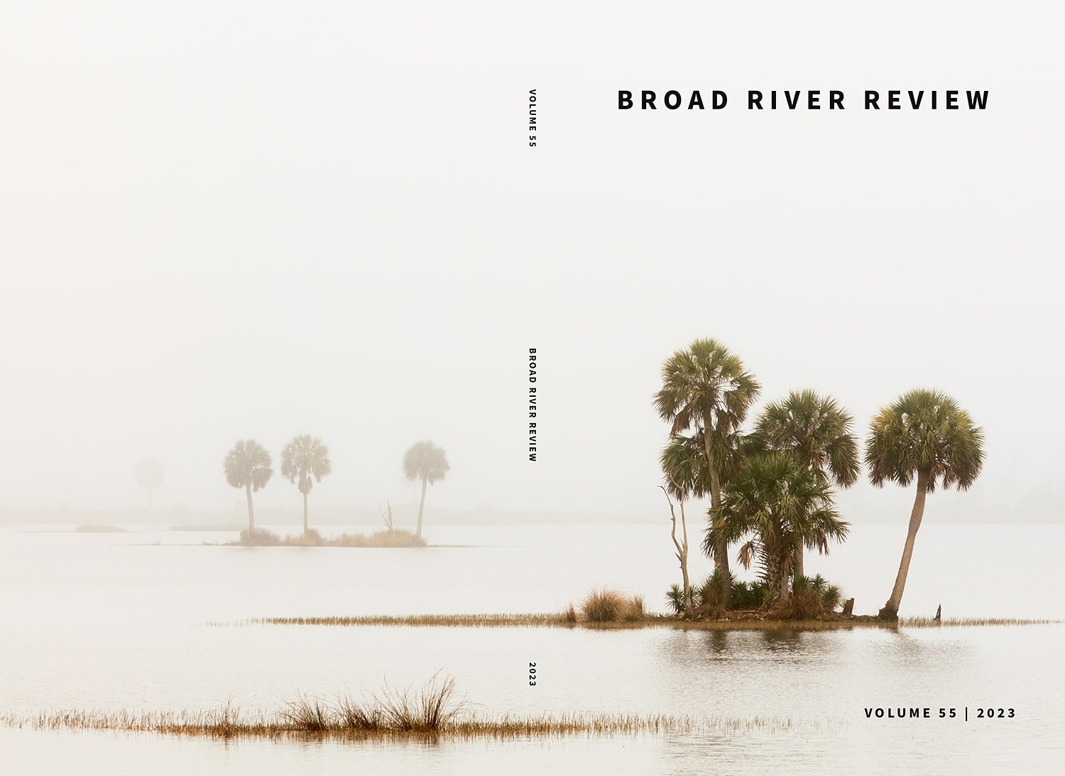 The cover of the 2023 edition of the Broad River Review features a landscape photograph of small palm tree islands enveloped in fog. The image is predominately white and wraps around to the back cover of the publication as well.